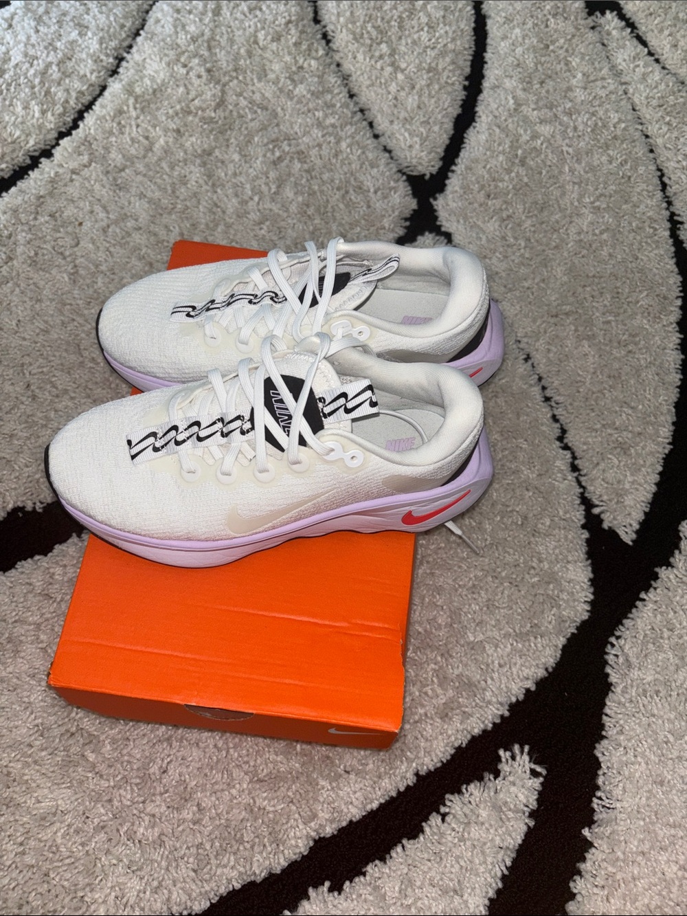 Nike White Sneakers with Black Logo Accents